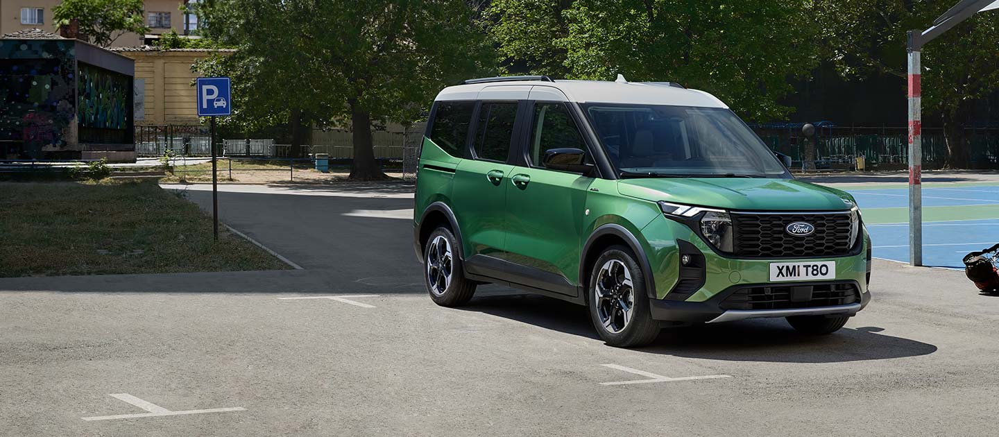 ford e_tourneo_courier eu Large_Card_Short_01_V769_Tourneo_Courier_Ext 16x7 1440x630 green tourneo courier parked